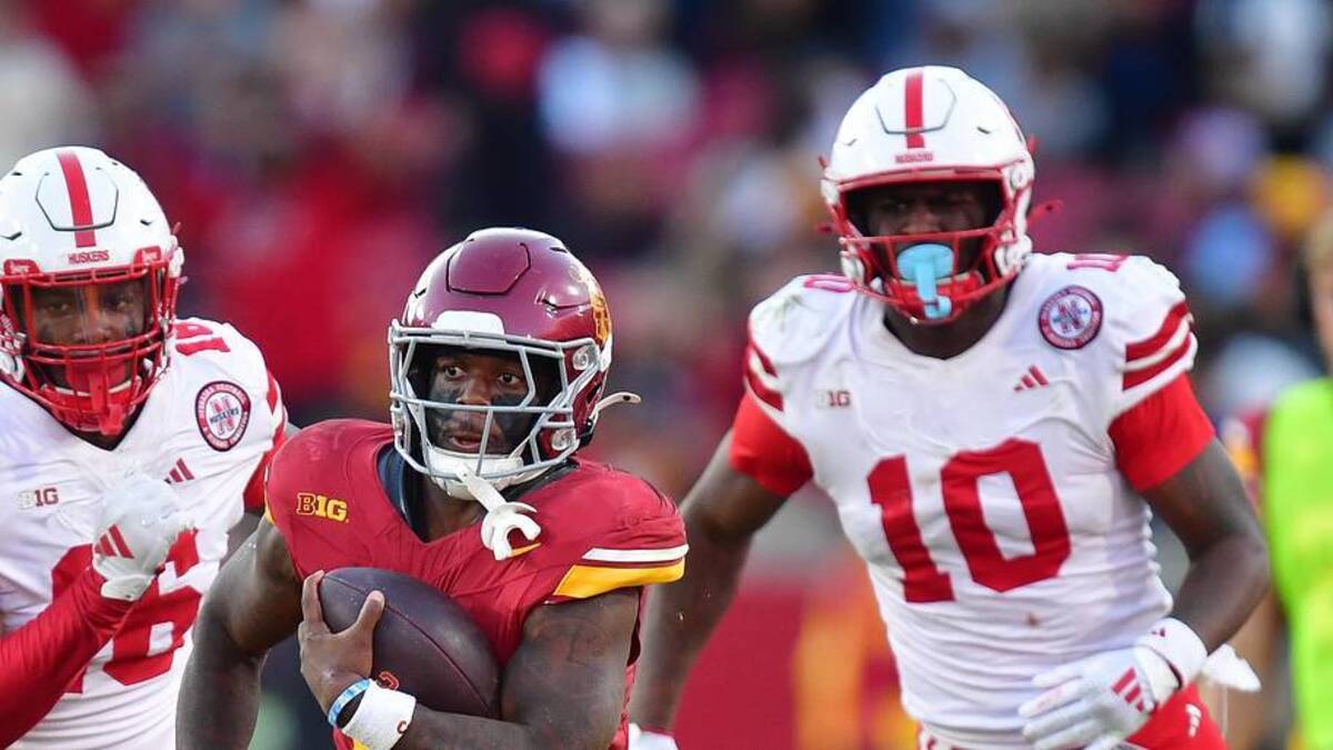  Nov 16, 2024; Los Angeles, California, USA; Southern California Trojans running back Woody Marks (4) runs the ball ahead of Nebraska Cornhuskers defensive lineman Elijah Jeudy (16) during the second half at the Los Angeles Memorial Coliseum. Mandatory Credit: Gary A. Vasquez-Imagn Images | Gary A. Vasquez-Imagn Images 