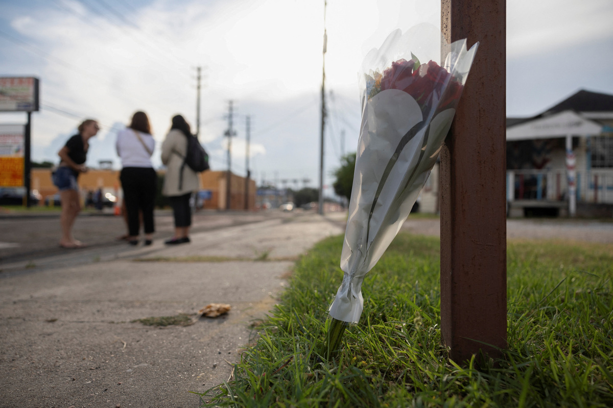 Flowers sit at the scene where an ICE agent fatally shot a Mexican motorist, identified as Lorenzo Salgado Araujo, during a vehicle stop in Houston, Texas, U.S., July 7, 2026. REUTERS/Antranik Tavitian