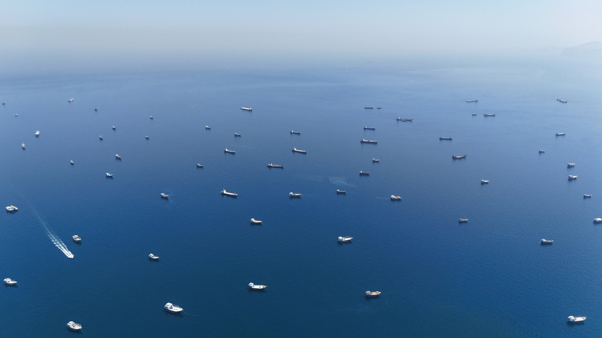 A drone view of vessels anchored in the Strait of Hormuz as seen from Musandam, Oman, June 8, 2026. REUTERS/Stringer