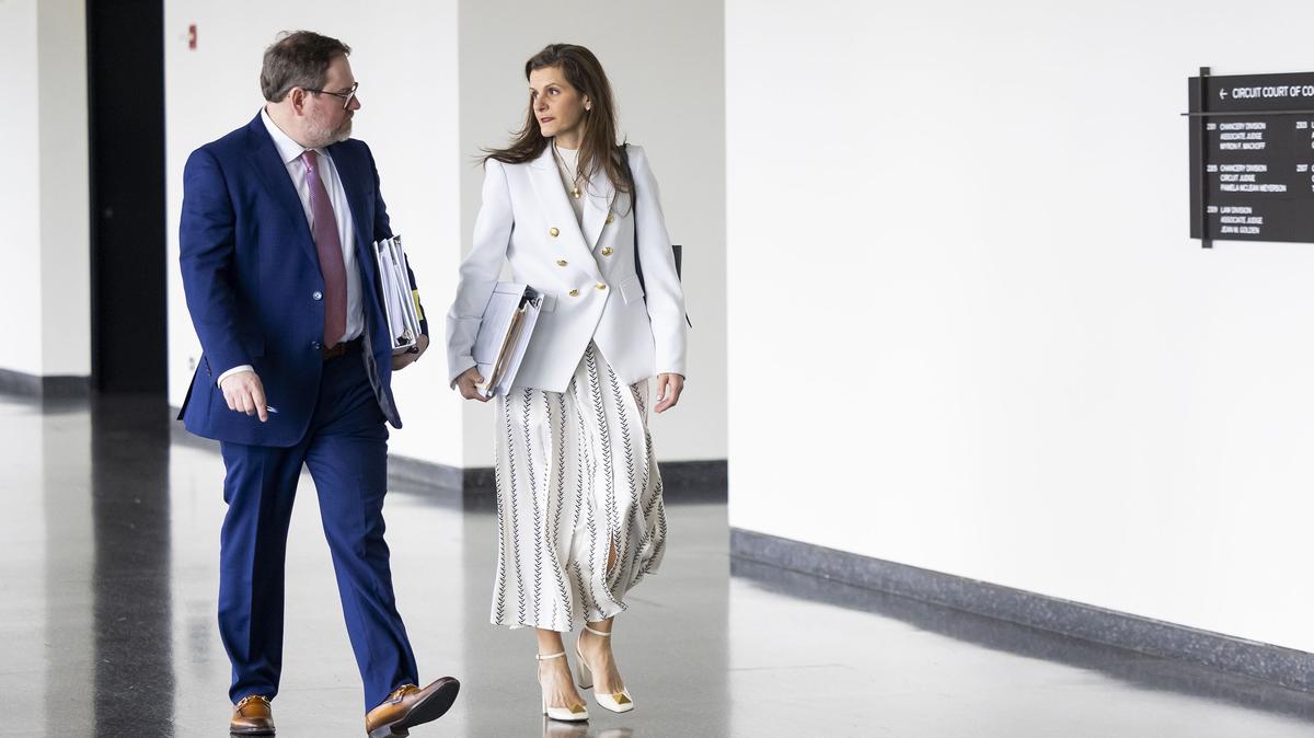 Richard Howell, left, and Hariklia Karis, attorneys representing Abbott Laboratories, walk to the courtroom at the Daley Center in Chicago on April 6, 2026, after a break in the trial against Abbott Laboratories for formula given to pre-term infants. (Eileen T. Meslar/Chicago Tribune/TNS)