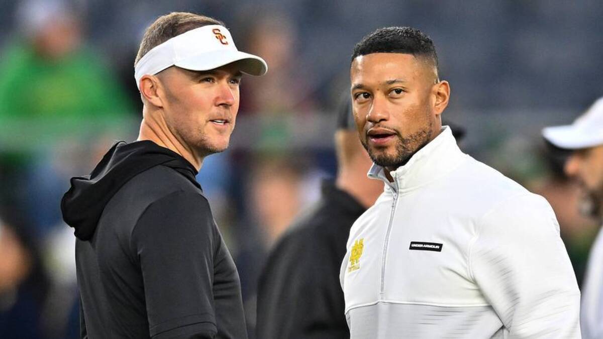  Oct 14, 2023; South Bend, Indiana, USA; USC Trojans head coach Lincoln Riley and Notre Dame Fighting Irish head coach Marcus Freeman chat before the game at Notre Dame Stadium. Mandatory Credit: Matt Cashore-Imagn Images | Matt Cashore-Imagn Images 
