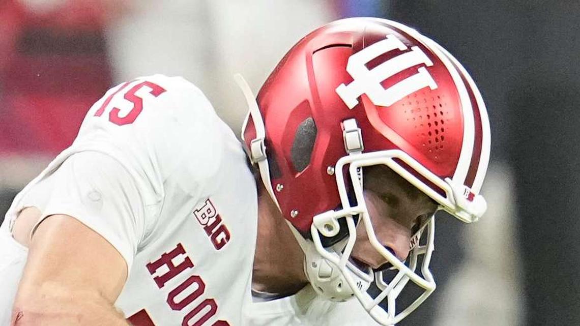  Ohio State Buckeyes linebacker Sonny Styles (0) hits Indiana Hoosiers quarterback Fernando Mendoza (15) during the first half of the Big Ten Conference championship game at Lucas Oil Stadium in Indianapolis on Dec. 6, 2025. | Adam Cairns/Columbus Dispatch / USA TODAY NETWORK via Imagn Images 