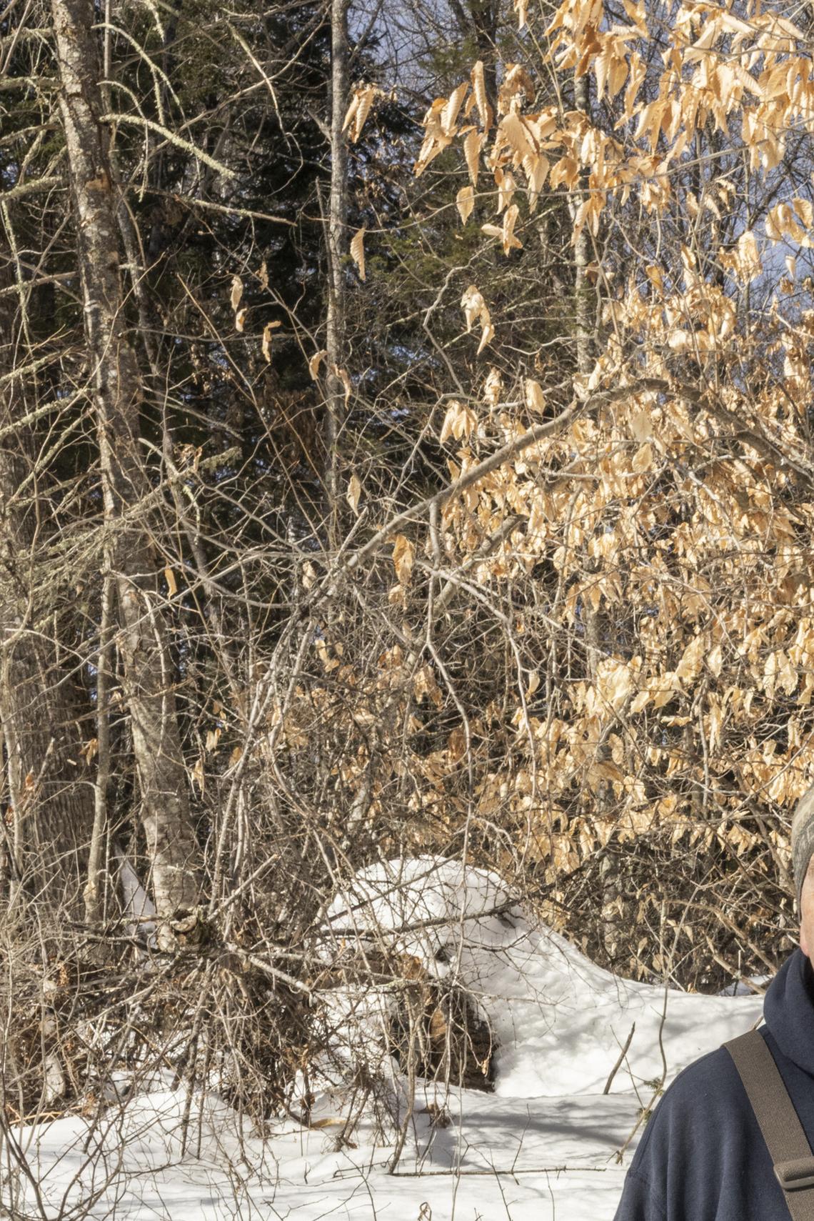 Paul Christman, a marine scientist with the Maine Department of Marine Resources, on a brook in Farmington, Maine, March 3, 2026. The fragile hope for salmon recovery in Maine: a long-term project to remove or modify dams may clear the way for endangered wild Atlantic salmon to swim freely up to the Sandy River, but it faces opposition from business and lawmakers. (Greta Rybus/The New York Times)