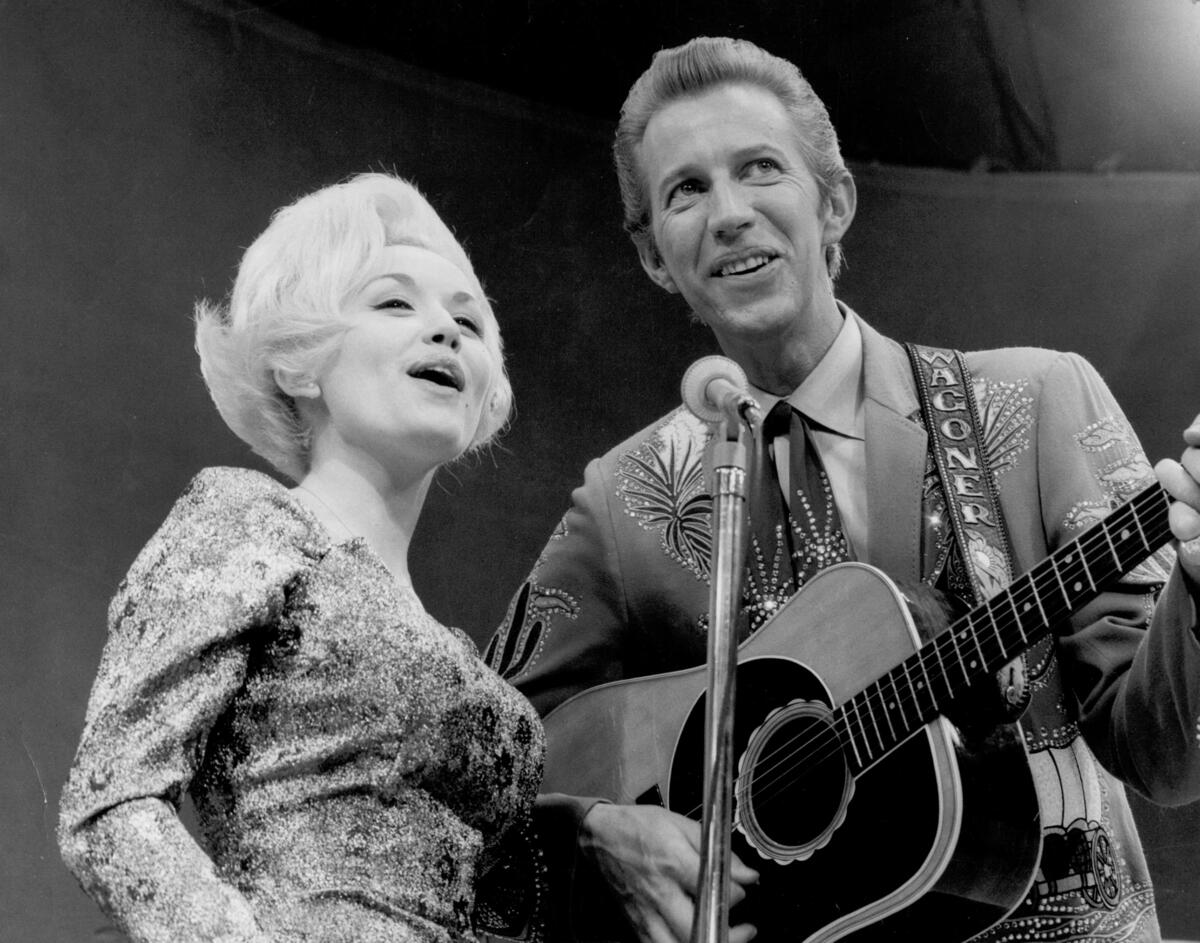 Dolly Parton and Porter Wagoner onstage in 1967.Michael Ochs Archives/Getty Images