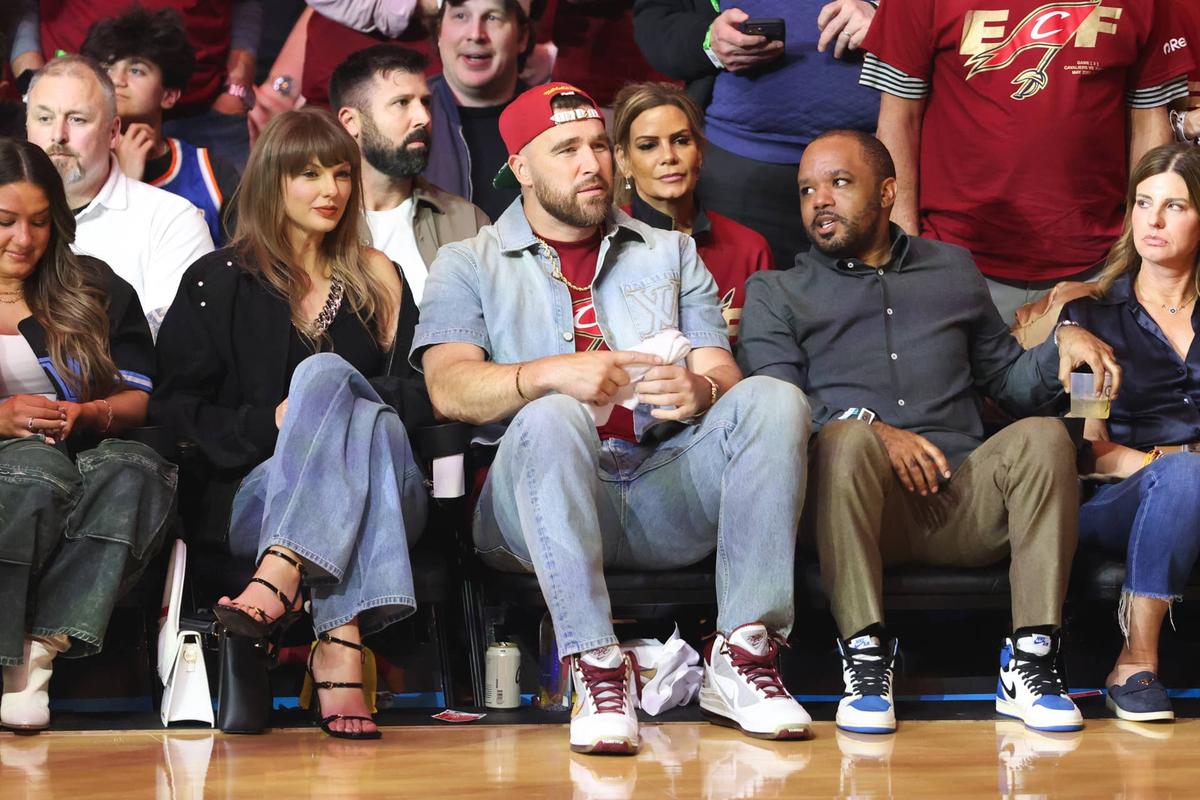  May 23, 2026; Cleveland, Ohio, USA; Taylor Swift and Travis Kelce look on during game three of the eastern conference finals for the 2026 NBA playoffs between the New York Knicks and Cleveland Cavaliers at Rocket Arena. Mandatory Credit: Scott Galvin-Imagn Images 