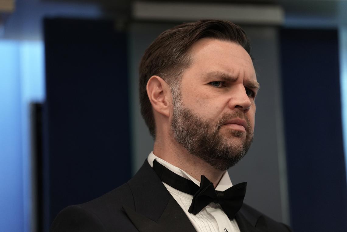 Vice President JD Vance looks on as President Donald Trump briefs reporters at the White House after shots were fired during the White House Correspondents' Association dinner at the Washington Hilton in Washington on Saturday, April 25, 2026. Trump was rushed from the stage but was unharmed. (Salwan Georges/The New York Times)
