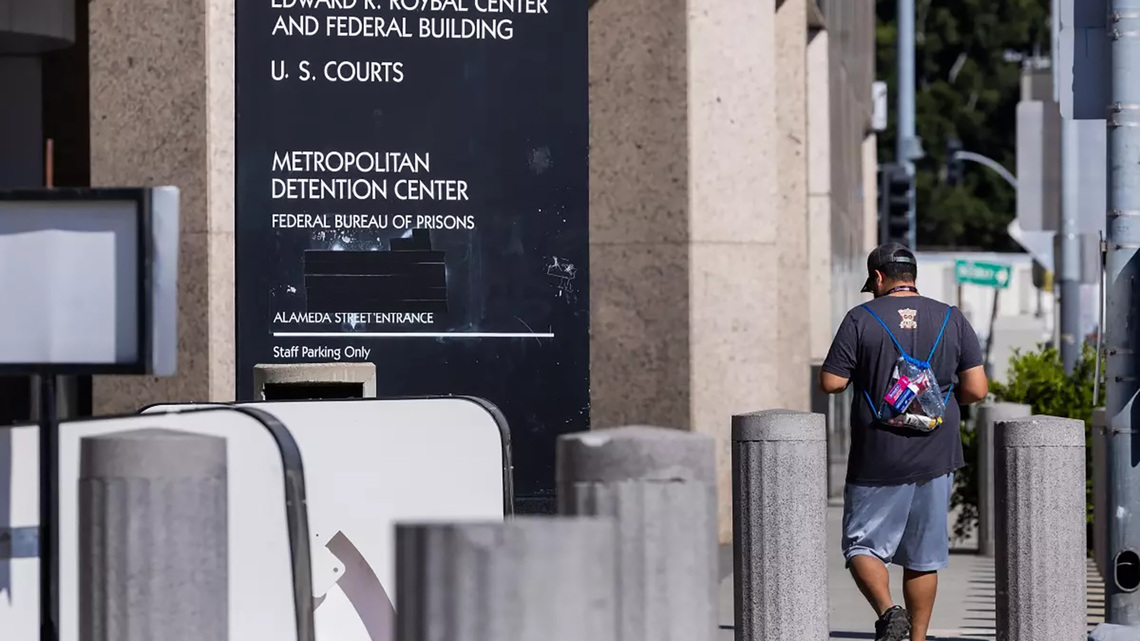 Federal officer pulls gun in clash with protesters in downtown LA 
