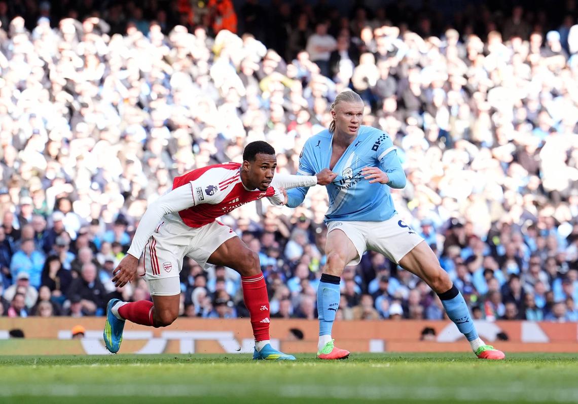  Arsenal's Gabriel Magalhaes (left) marks Manchester City's Erling Haaland during the Premier League match at the Etihad Stadium, Manchester. Picture date: Sunday April 19, 2026. (Photo by Martin Rickett/PA Images via Getty Images) Photo by Martin Rickett/PA Images via Getty Images