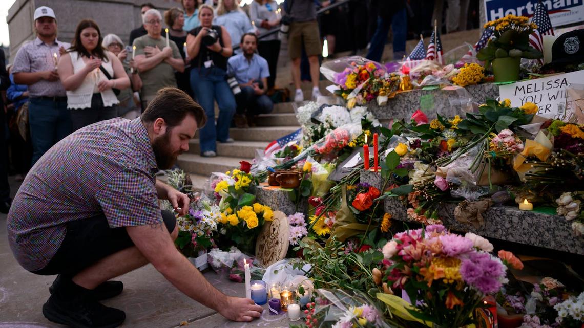 Colin Hortman, son of former Minnesota House Leader Melissa Hortman and her husband, Mark Hortman, places a candle during a candlelight vigil on June 18, 2025, for his parents at the State Capitol. He hopes people remember his parents for the way they lived. (Aaron Lavinsky/The Minnesota Star Tribune/TNS)