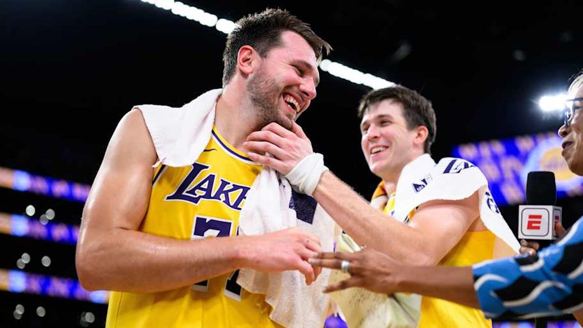  Mar 14, 2026; Los Angeles, California, USA; Los Angeles Lakers guard Luka Doncic (77) reacts with guard Austin Reaves (15) after scoring a game-winning shot during overtime against the Denver Nuggets at Crypto.com Arena. Mandatory Credit: William Liang-Imagn Images | William Liang-Imagn Images 