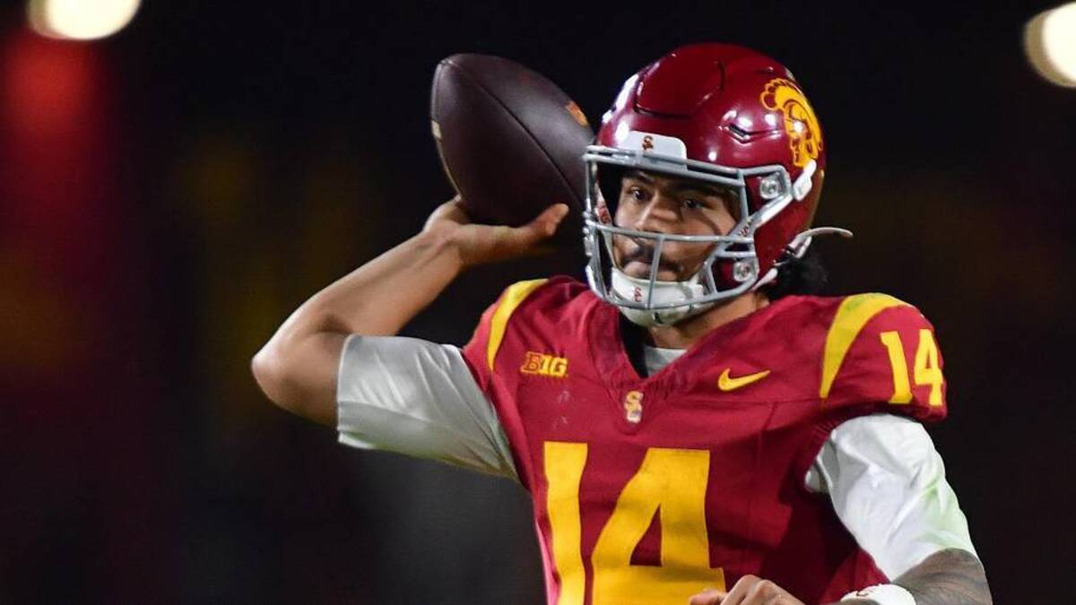  Nov 7, 2025; Los Angeles, California, USA; Southern California Trojans quarterback Jayden Maiava (14) throws against the Northwestern Wildcats during the second half at the Los Angeles Memorial Coliseum. Mandatory Credit: Gary A. Vasquez-Imagn Images | Gary A. Vasquez-Imagn Images 