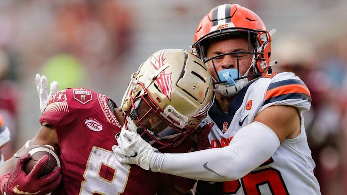  Syracuse Orange defensive back Aman Greenwood (26) grabs the face mask on Florida State Seminoles running back Treshaun Ward's (8) helmet. The Florida State Seminoles defeated the Syracuse Orange 33-30 to get their first win of the season Saturday, Oct. 2, 2021. Fsu V Syracuse2142 | Alicia Devine/Tallahassee Democrat / USA TODAY NETWORK 