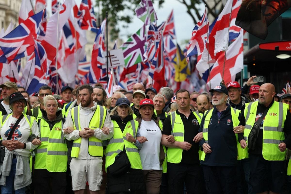 Protesters take part in a "Unite the Kingdom" rally organised by British anti-immigration activist Stephen Yaxley-Lennon, also known as Tommy Robinson, in London, Britain, May 16, 2026. REUTERS/Hannah McKay