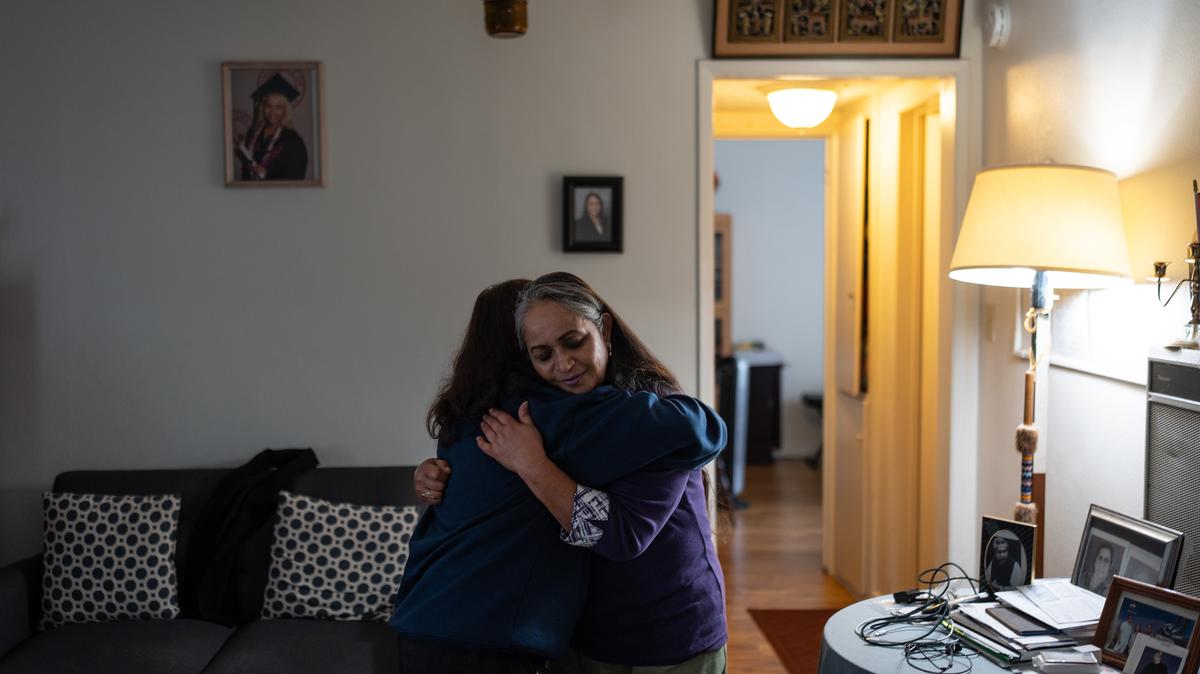 Masuma Khan (right) came to the U.S. from Bangladesh in 1997 and was detained for a month after she showed up for a regular check-in with U.S. Immigration and Customs Enforcement in October 2025. Here, she hugs her daughter, Riya, left. (Jae C. Hong/AP/KFF Health News/TNS)