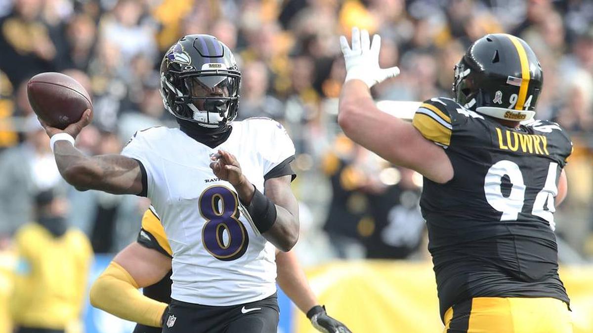  Nov 17, 2024; Pittsburgh, Pennsylvania, USA; Baltimore Ravens quarterback Lamar Jackson (8) passes against pressure from Pittsburgh Steelers defensive tackle Dean Lowry (94) during the first quarter at Acrisure Stadium. Mandatory Credit: Charles LeClaire-Imagn Images | Charles LeClaire-Imagn Images 