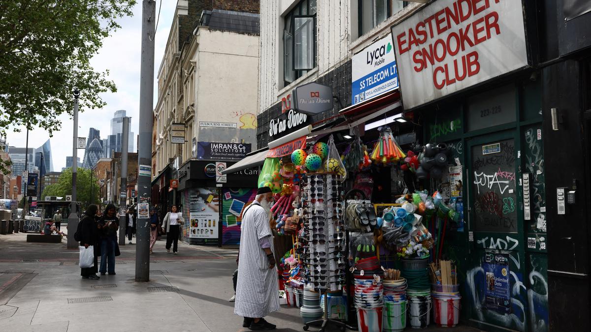 A man looks at sunglasses displayed outside a shop in Tower Hamlets, London, Britain, May 3, 2026. REUTERS/Jack Taylor