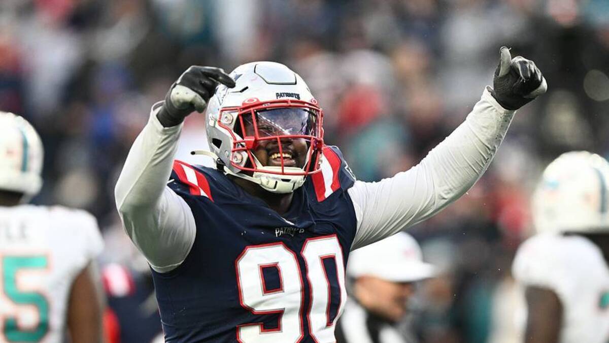 Jan 1, 2023; Foxborough, Massachusetts, USA; New England Patriots defensive tackle Christian Barmore (90) reacts after a sack against the Miami Dolphins during the second half at Gillette Stadium. Mandatory Credit: Brian Fluharty-USA TODAY Sports | USA TODAY Sports 