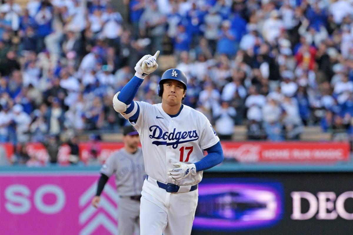 Los Angeles Dodgers two-way player Shohei Ohtani celebrates after hitting a solo home run during the first inning against the Colorado Rockies at Dodger Stadium. Jayne Kamin-Oncea-Imagn Images