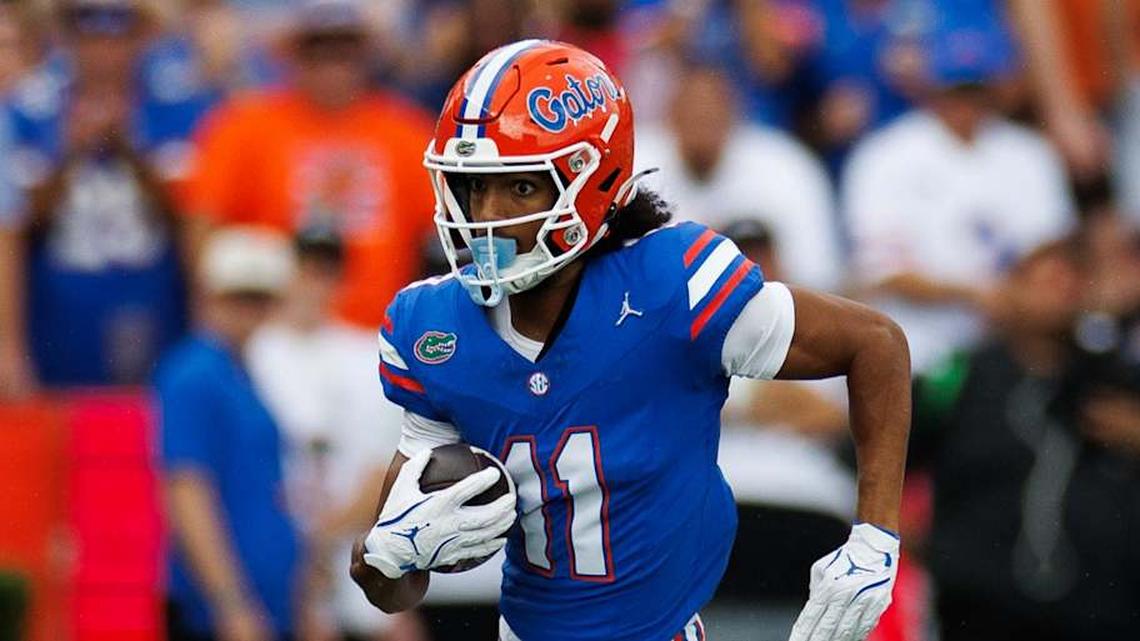  Oct 4, 2025; Gainesville, Florida, USA; Florida Gators wide receiver Aidan Mizell (11) runs with the ball against the Texas Longhorns during the first half at Ben Hill Griffin Stadium. Mandatory Credit: Matt Pendleton-Imagn Images | Matt Pendleton-Imagn Images 
