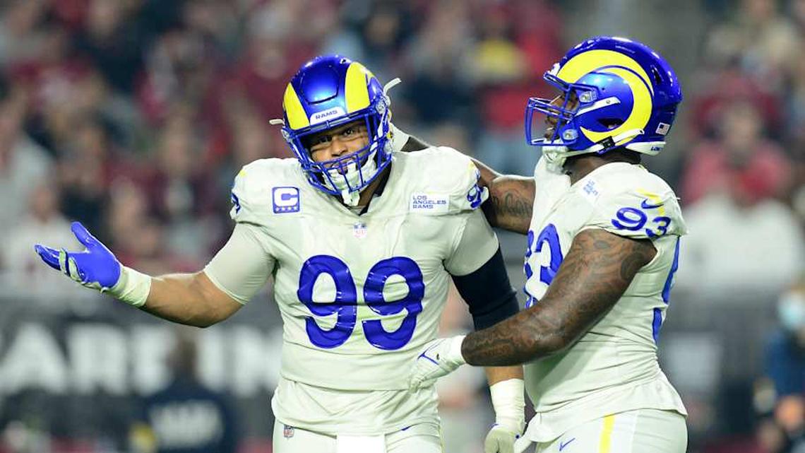  Dec 13, 2021; Glendale, Arizona, USA; Los Angeles Rams defensive end Aaron Donald (99) celebrates a sack with defensive tackle Marquise Copeland (93) against the Arizona Cardinals during the first half at State Farm Stadium. Mandatory Credit: Joe Camporeale-Imagn Images | Joe Camporeale-Imagn Images 