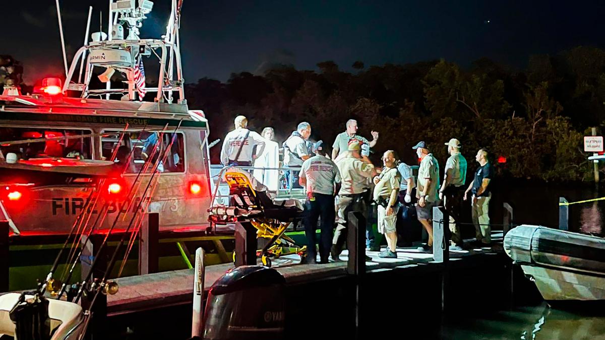 This image provided by Miami-Dade Fire Rescue shows agents at the scene of a boat crash near Boca Chita Key, Fla. Sunday, Sept. 4, 2022. (Miami-Dade Fire Rescue via AP)