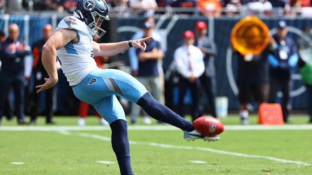  Sep 8, 2024; Chicago, Illinois, USA; Tennessee Titans punter Ryan Stonehouse (4) punts the ball against the Chicago Bears during the first quarter at Soldier Field. Mandatory Credit: Mike Dinovo-Imagn Images | Mike Dinovo-Imagn Images 