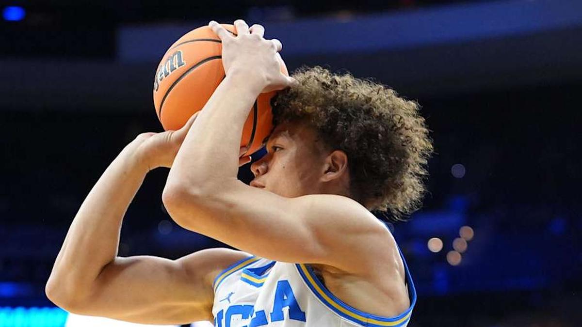  Mar 20, 2026; Philadelphia, PA, USA; UCLA Bruins guard Trent Perry (0) shoots the ball against the UCF Knights in the first half during a first round game of the men's 2026 NCAA Tournament at Xfinity Mobile Arena. Mandatory Credit: Kyle Ross-Imagn Images | Kyle Ross-Imagn Images 