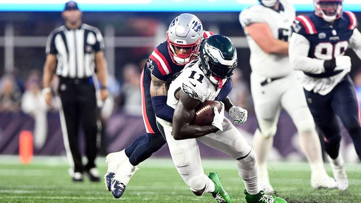  Sep 10, 2023; Foxborough, Massachusetts, USA; Philadelphia Eagles wide receiver A.J. Brown (11) is tackled by New England Patriots cornerback Christian Gonzalez (6) during the second half at Gillette Stadium. Mandatory Credit: Brian Fluharty-Imagn Images | Brian Fluharty-Imagn Images 