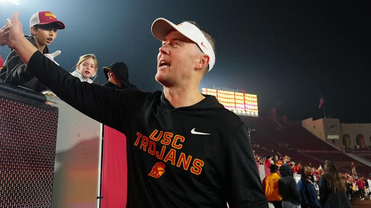  Southern California Trojans head coach Lincoln Riley celebrates with fans after the game against the UCLA Bruins at United Airlines Field at Los Angeles Memorial Coliseum. | Kirby Lee-Imagn Images 