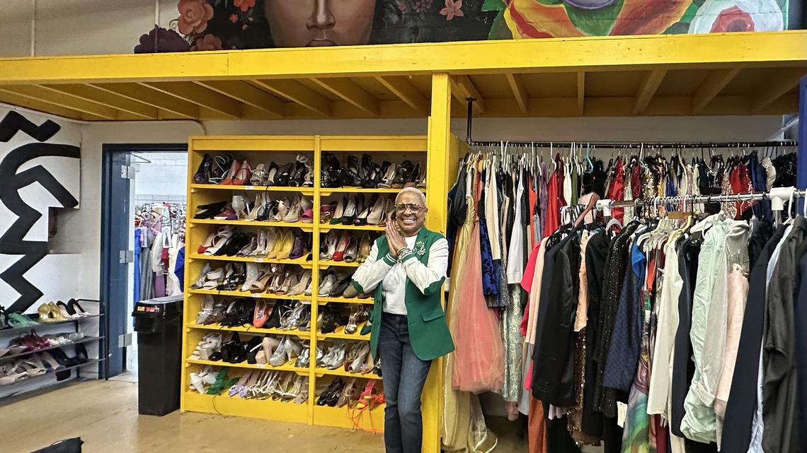 Special education teacher Tyesa Walton stands inside Chloe’s Closet in Dunbar Vocatiobal Career Academy in Chicago’s Bronzeville neighborhood. Walton founded Chloe’s Closet to provide prom dresses and other clothing for students who need them, in honor of her late daughter. (Sylvia Barragan/TNS)