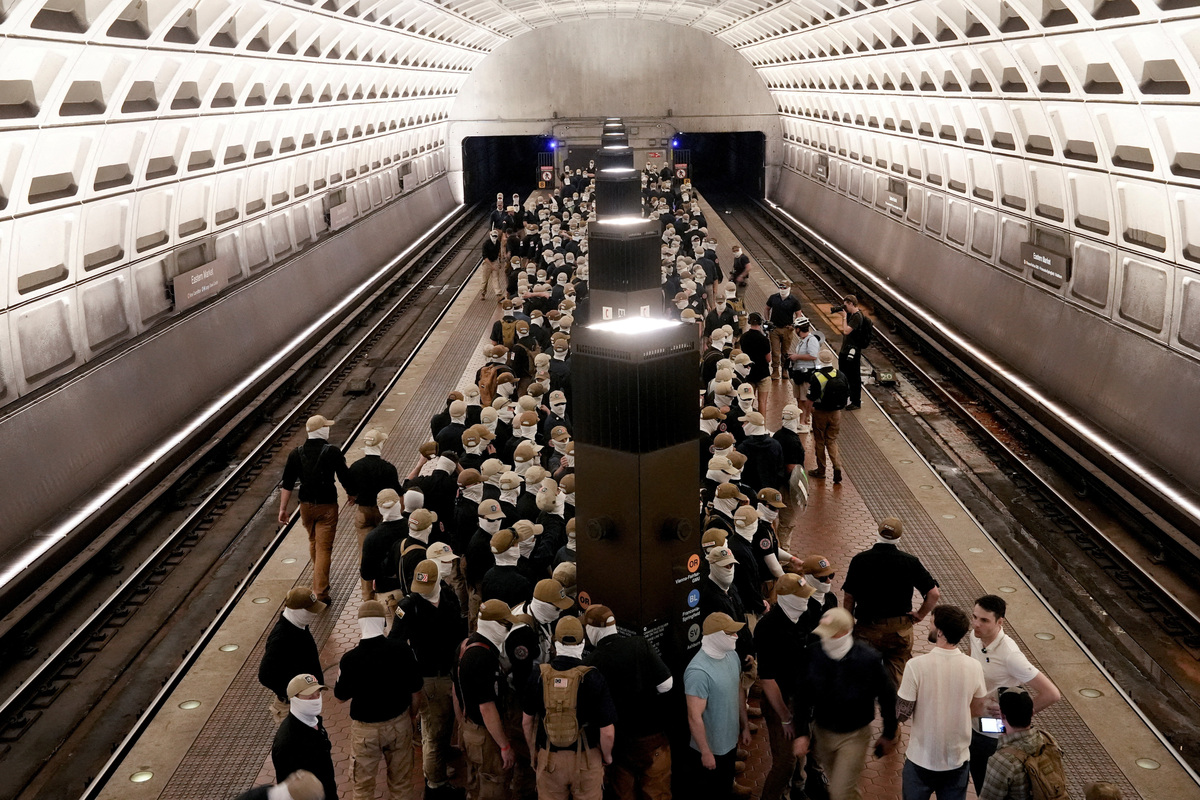 Members of the group Patriot Front wait to board the Metro on the 250th anniversary of U.S. independence in Washington, D.C., U.S., July 4, 2026. REUTERS/Cheney Orr