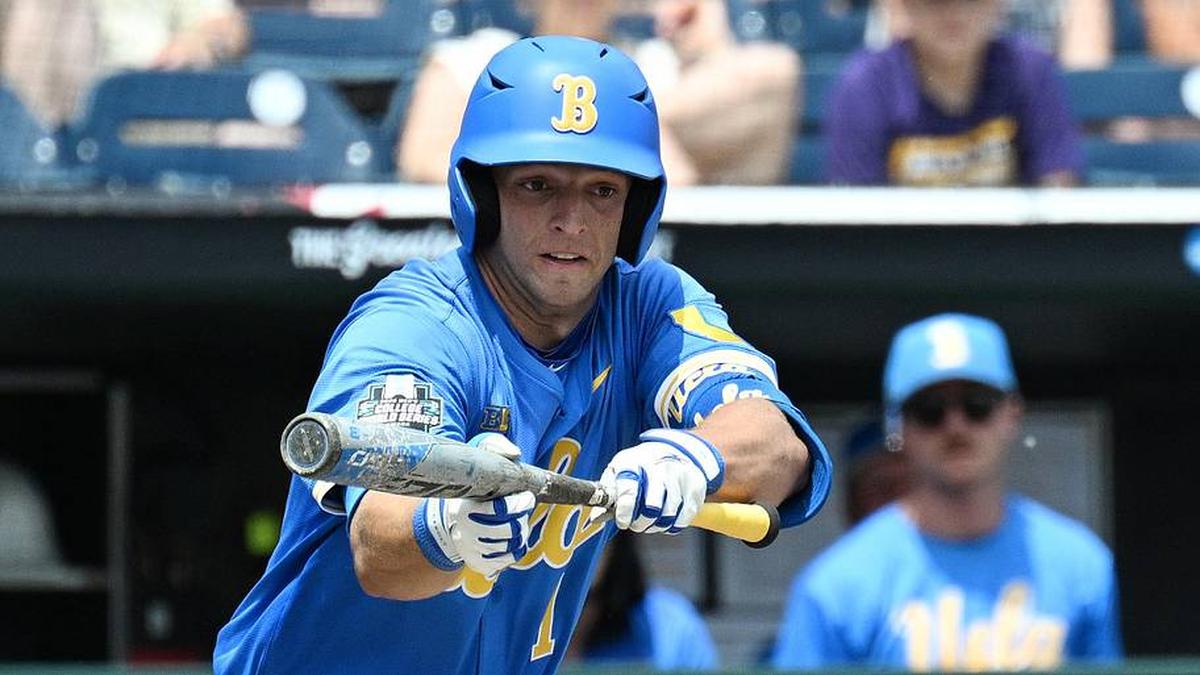  Jun 14, 2025; Omaha, Neb, USA; UCLA Bruins shortstop Roch Cholowsky (1) bunts in a run against the Murray State Racers during the fourth inning at Charles Schwab Field. Mandatory Credit: Steven Branscombe-Imagn Images | Steven Branscombe-Imagn Images 