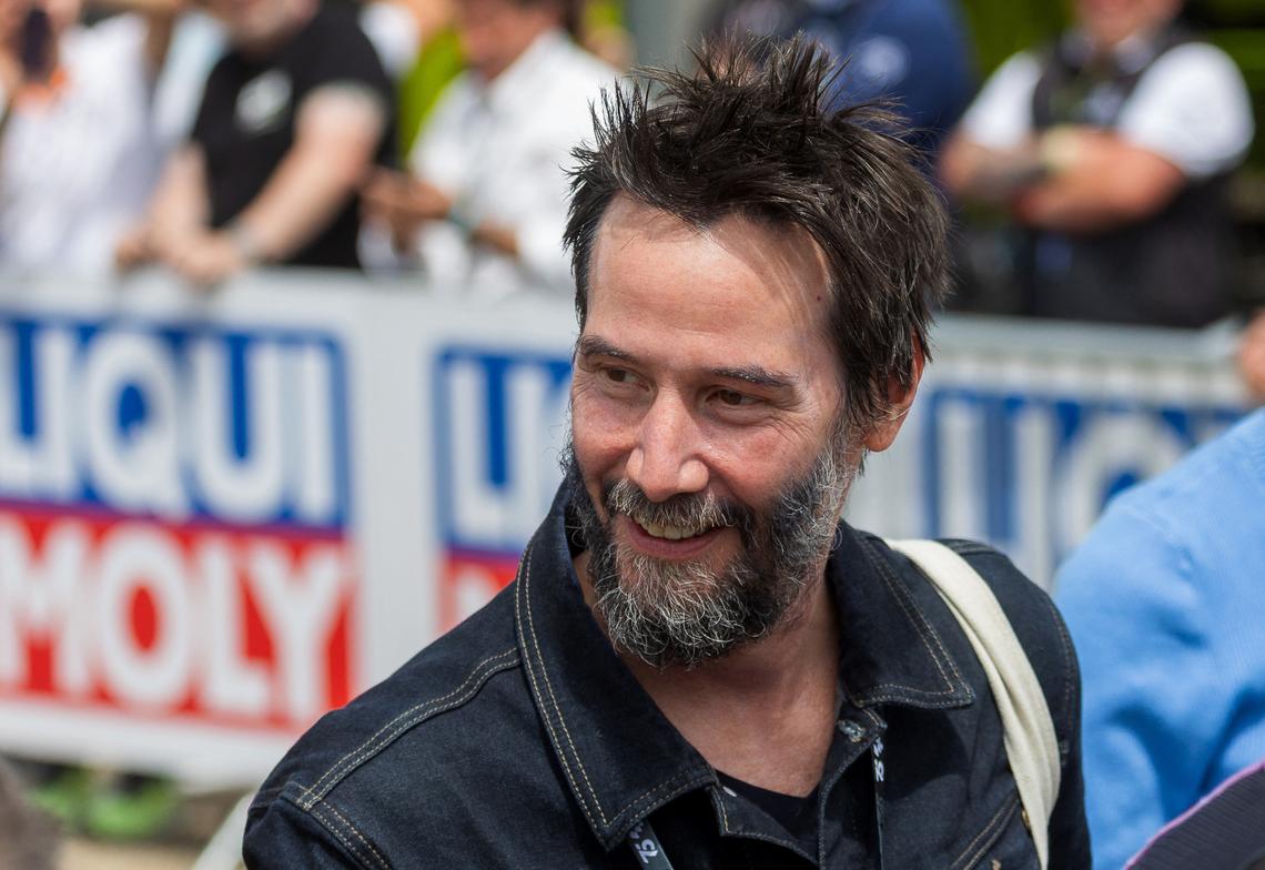 Canadian actor Keanu Reeves attends the German Motorcycle Grand Prix at the Sachsenring racetrack in Hohenstein-Ernstthal, eastern Germany, on July 7, 2024. (Photo by Radek Mica / AFP) (Photo by RADEK MICA/AFP via Getty Images)