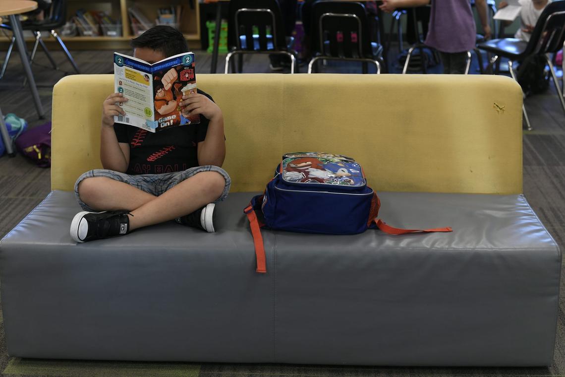  A 7-year-old child takes part in a literacy program in Commerce City, Colo., in October 2016. John Leyba/The Denver Post via Getty Images 