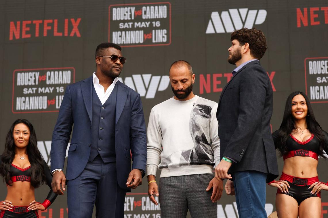  Francis Ngannou (L) and Brazilian Philipe Lins face off 