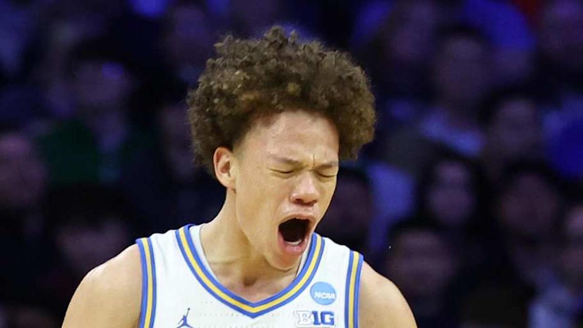  Mar 20, 2026; Philadelphia, PA, USA; UCLA Bruins guard Trent Perry (0) reacts with guard Eric Freeny (8) in the second half during a first round game of the men's 2026 NCAA Tournament at Xfinity Mobile Arena. Mandatory Credit: Bill Streicher-Imagn Images | Bill Streicher-Imagn Images 