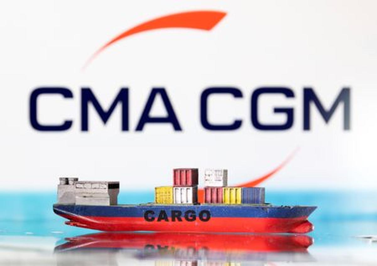 A cargo ship boat model is pictured in front of the CMA CGM logo in this illustration taken March 3, 2022. REUTERS/Dado Ruvic/Illustration