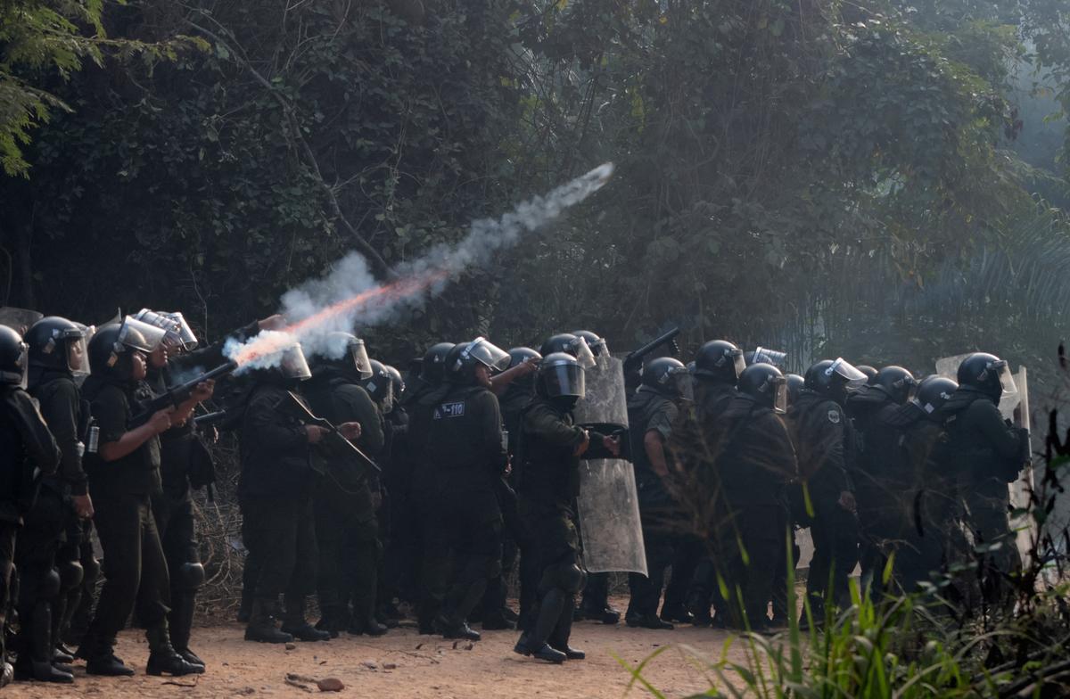 Police officers fire tear gas while clashing with community members who seized the Humberto Suarez oil facility to call for the resignation of President Rodrigo Paz, as ongoing protests have led to shortages of fuel and food, in Santa Rosa del Sara, Bolivia, June 3, 2026. REUTERS/Ipa Ibanez
