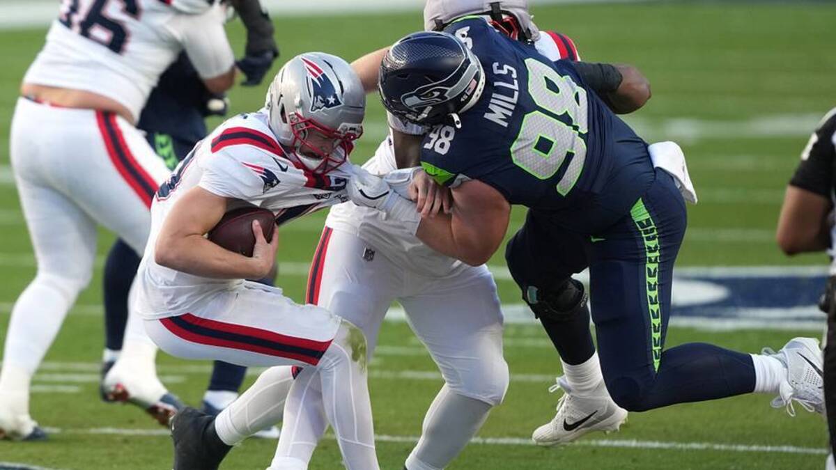  Feb 8, 2026; Santa Clara, CA, USA; New England Patriots quarterback Drake Maye (center left) is sacked by Seattle Seahawks defensive tackle Rylie Mills (98) during the second quarter in Super Bowl LX at Levi's Stadium. Mandatory Credit: Darren Yamashita-Imagn Images | IMAGN IMAGES via Reuters Connect 