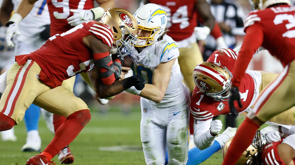 Los Angeles Chargers quarterback Justin Herbert (10) is hit by San Francisco 49ers linebacker Dre Greenlaw, left, and cornerback Jimmie Ward (1) during the first half of an NFL football game in Santa Clara, Calif., Sunday, Nov. 13, 2022. Greenlaw was disqualified after the play. (AP Photo/Jed Jacobsohn)