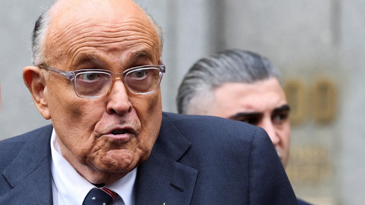 FILE PHOTO: Former Donald Trump lawyer and former New York City Mayor Rudolph Giuliani speaks to the media as he departs the U.S. Federal court following a hearing in his case to surrender valuables to Georgia election workers he was found to have defamed, in New York City, U.S., November 26, 2024. REUTERS/Brendan McDermid/File Photo