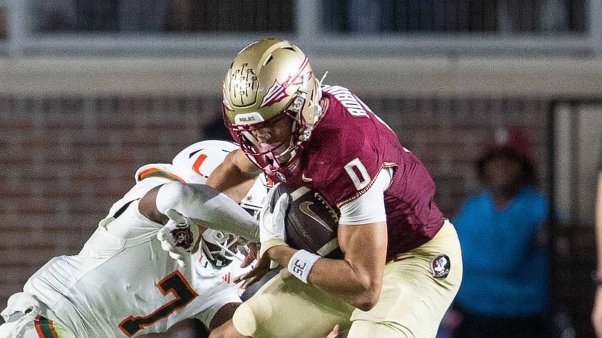  Florida State Seminoles wide receiver Duce Robinson (0) fights off a defender as he runs the ball down the field. The Miami Hurricanes defeated the Florida State Seminoles 22-28 at Doak Campbell Stadium on Saturday, Oct. 4, 2025. | USA TODAY Network via Reuters Connect 