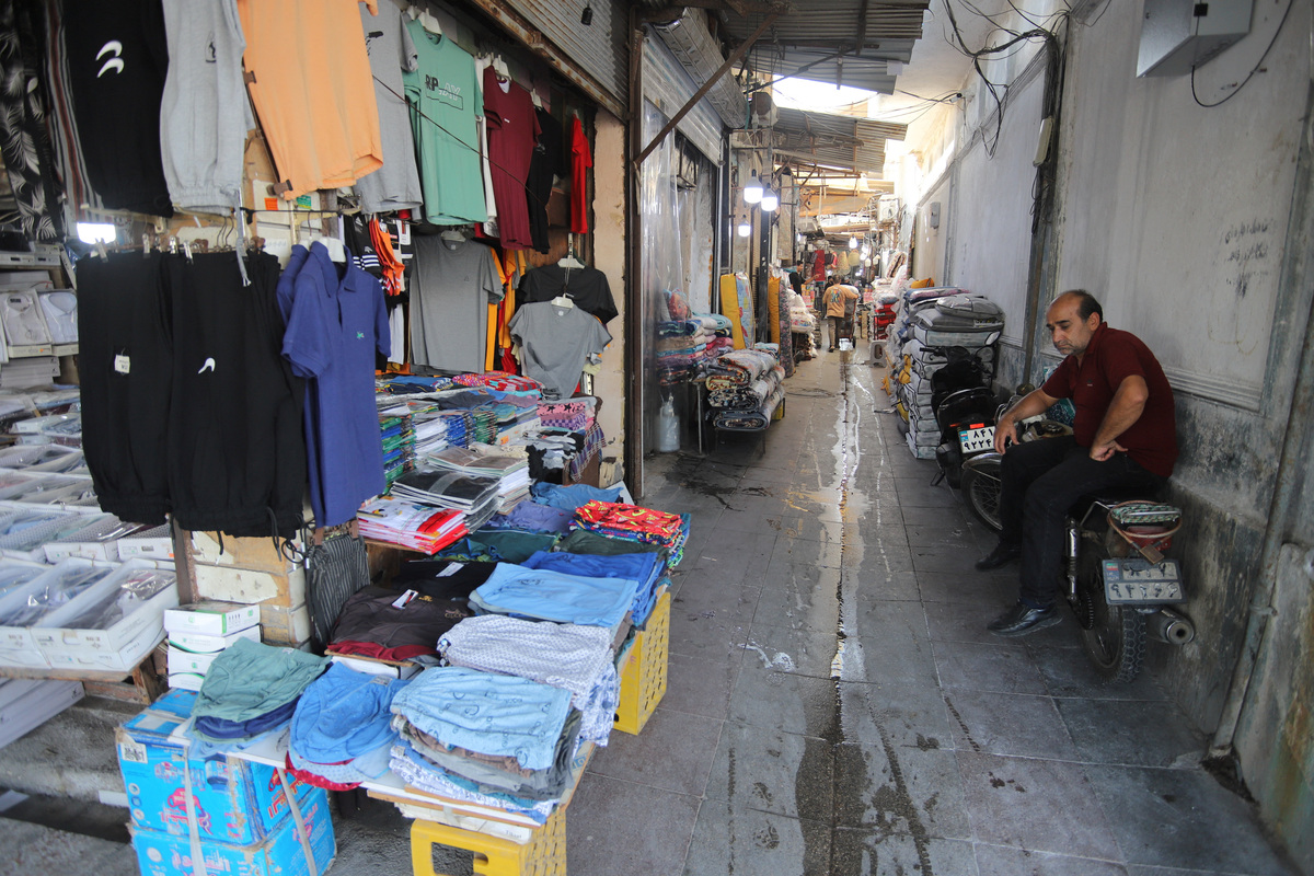 A man sits at a local market in Bandar Abbas, Iran, June 10, 2026. Amirhosein Khorgooi/ISNA/WANA (West Asia News Agency) via REUTERS