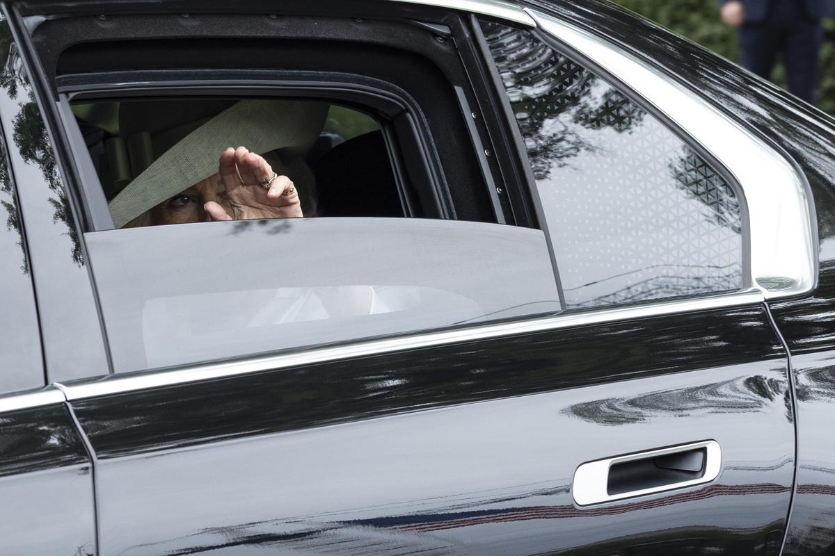 Queen Camilla waves as she and King Charles III depart after a visit to the White House in Washington, on Tuesday, April 28, 2026. (Anna Rose Layden/The New York Times)