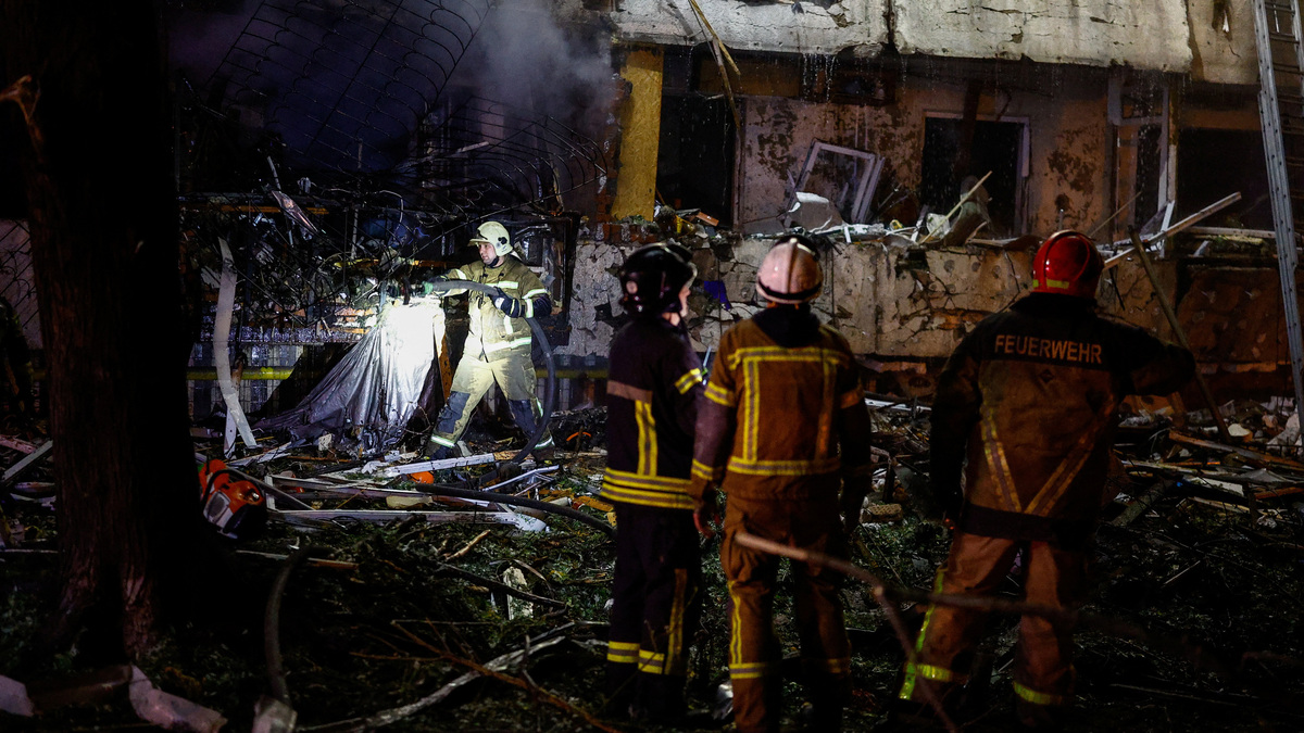 Russian missile attack on Kyiv kills two, Zelenskiy says no warning ...