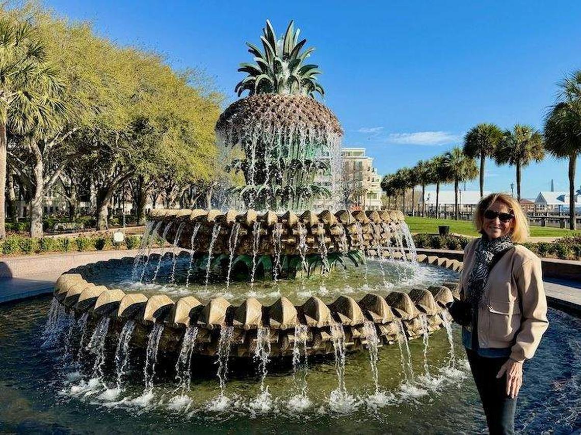  The author poses beside the Pineapple Fountain at Charleston's Waterfront Park, a symbol of Southern hospitality. Photo credit: Dave Kurtz 