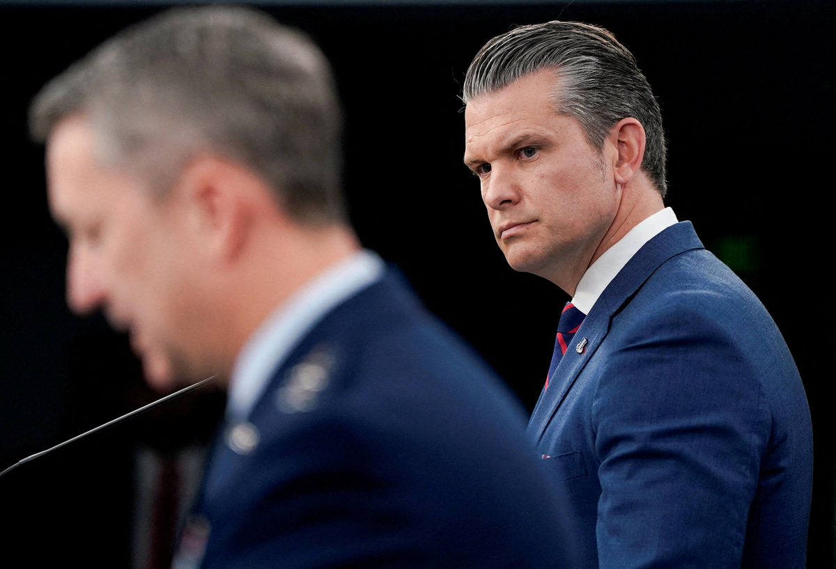 FILE PHOTO: U.S. Secretary of Defense Pete Hegseth and Chairman of the Joint Chiefs of Staff General Dan Caine hold a briefing amid the U.S.-Israeli conflict with Iran, at the Pentagon in Washington, D.C., U.S., March 2, 2026. REUTERS/Elizabeth Frantz//File Photo