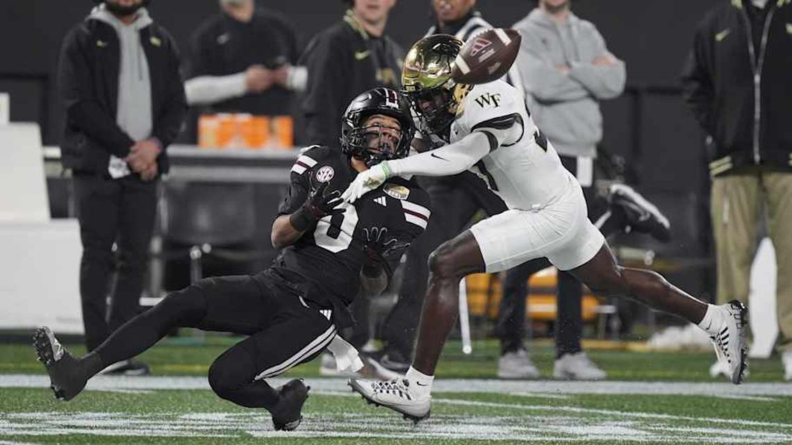  Jan 2, 2026; Charlotte, NC, USA; Mississippi State Bulldogs wide receiver Brenen Thompson (0) makes a opening play catch defended by Wake Forest Demon Deacons defensive back Karon Prunty (3) during the first quarter at Bank of America Stadium. Mandatory Credit: Jim Dedmon-Imagn Images | Jim Dedmon-Imagn Images 