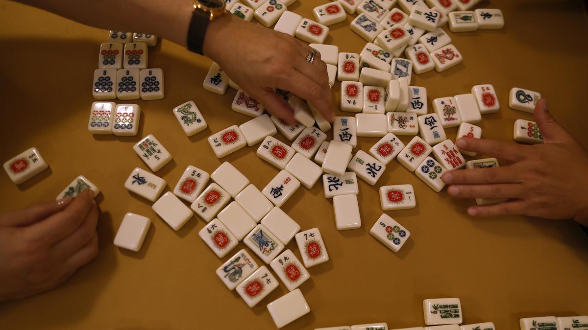 Players sort Mahjong tiles before playing a game of Mahjong at the Mahjong Lair at Dragon Well on Oct. 28, 2025, in San Francisco, California. (Justin Sullivan/Getty Images/TNS)