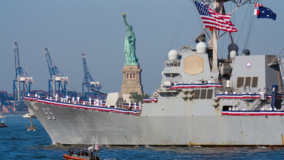 US Navy's Arleigh Burke-class destroyer USS Farragut (DDG-99) sails by the Statue of Liberty ahead of the Sail4th 250 parade of ships in New York Harbor for the United States 250th anniversary on Independence Day in New York on July 4, 2026. Millions of Americans celebrate the country's 250th birthday on July 4, 2026, as the landmark celebration comes at a time of deep political division, with a president determined to put his stamp on the festivities. (Ryan Murphy/AFP/Getty Images/TNS)